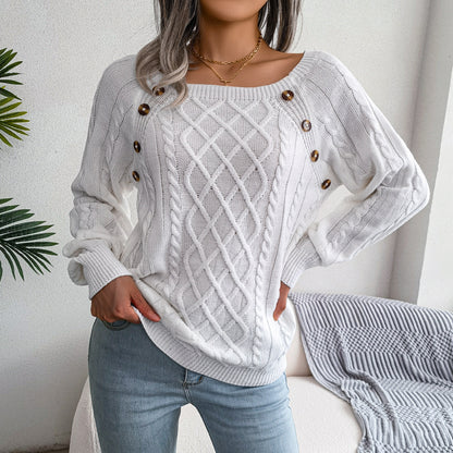Button-detail cable-knit sweater in white, front view