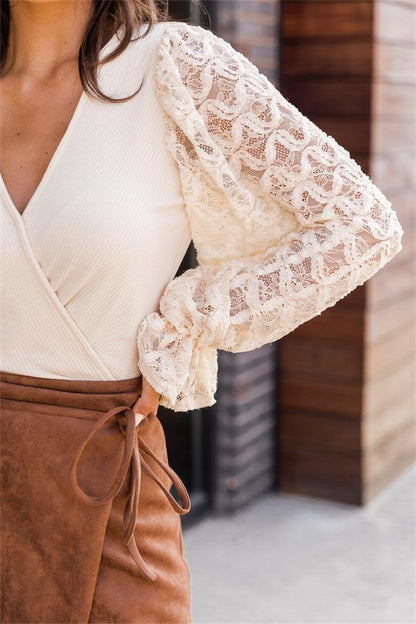 Close-up of the open-work lace sleeve