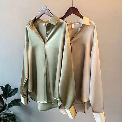 Satin-effect shirts in several colours on hangers
