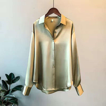 Satin-effect button-up shirt in green on a hanger