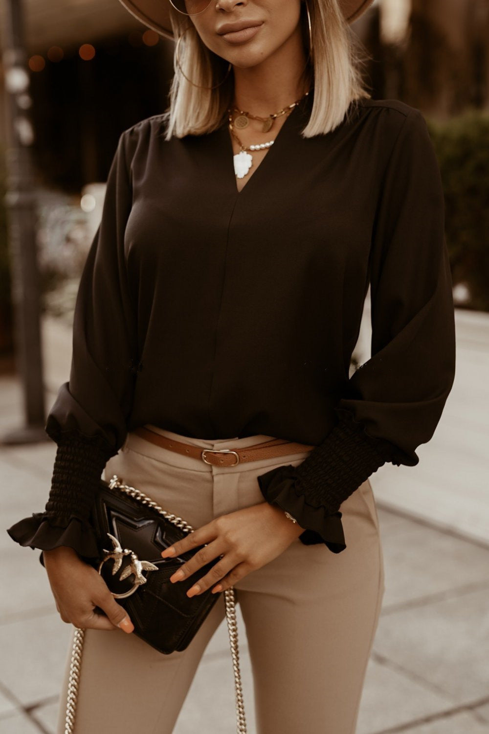 Cuff-detail V-neck blouse in black