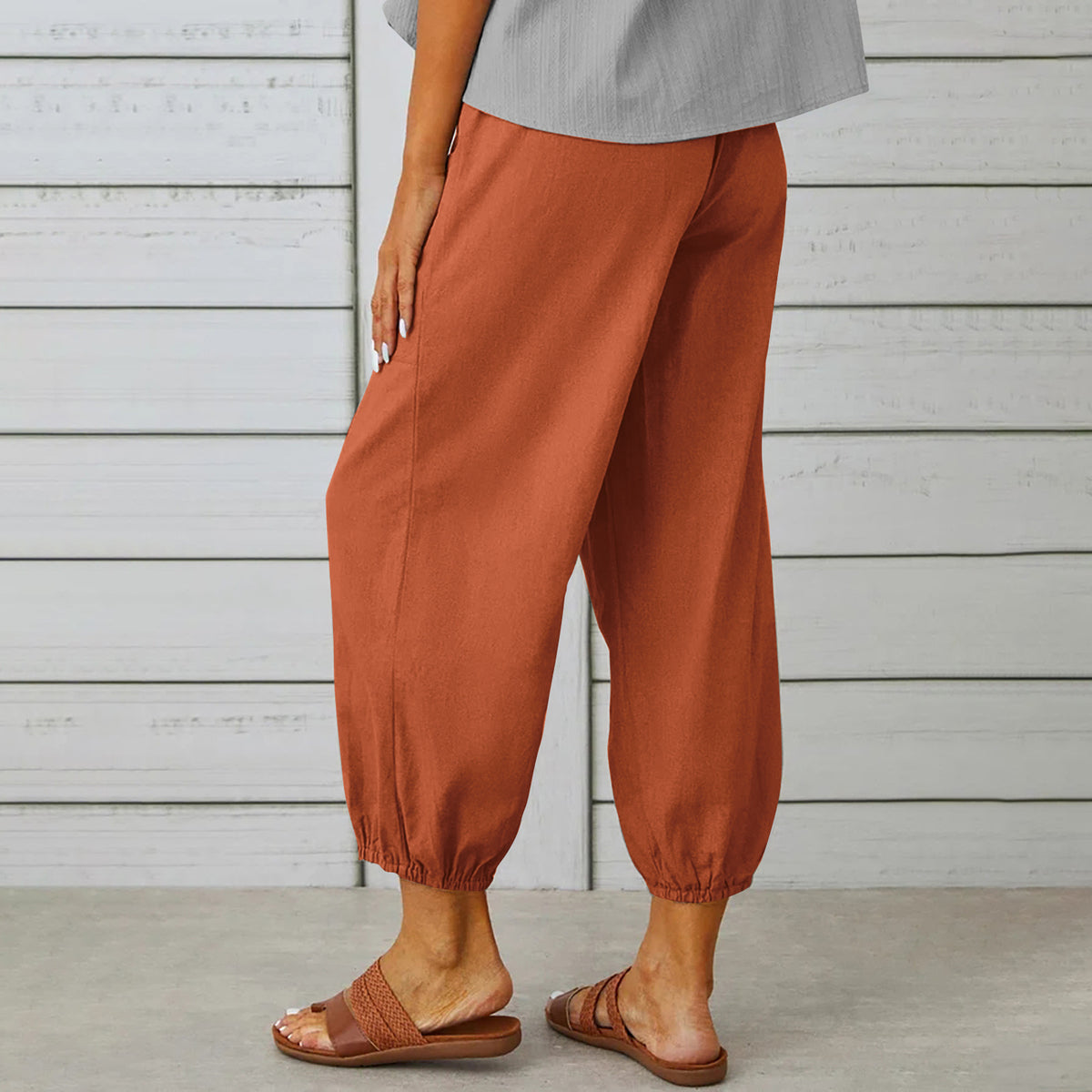 Drawstring tapered trousers in brick red, side view