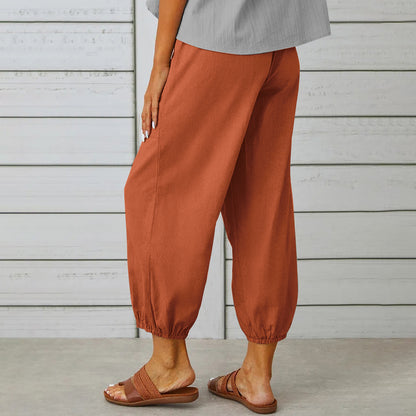 Drawstring tapered trousers in brick red, side view