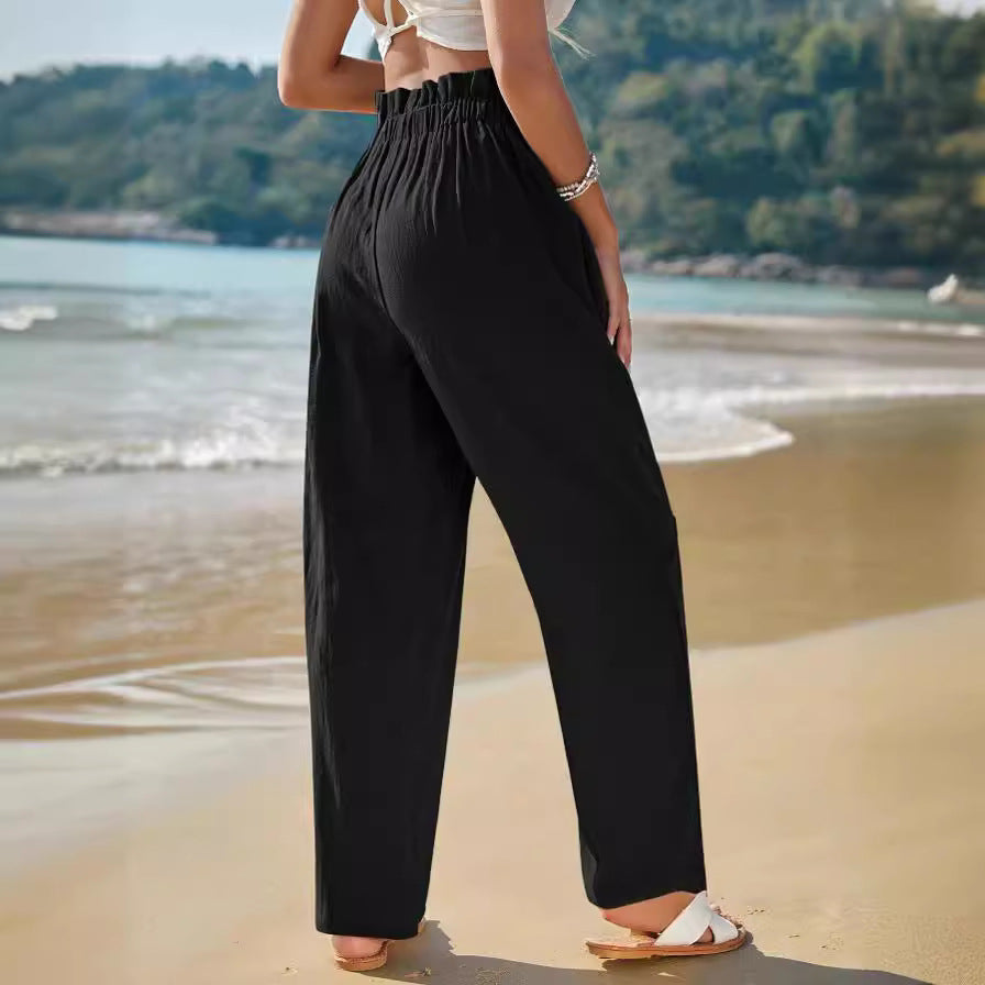 Button-front tapered trousers in black, side view
