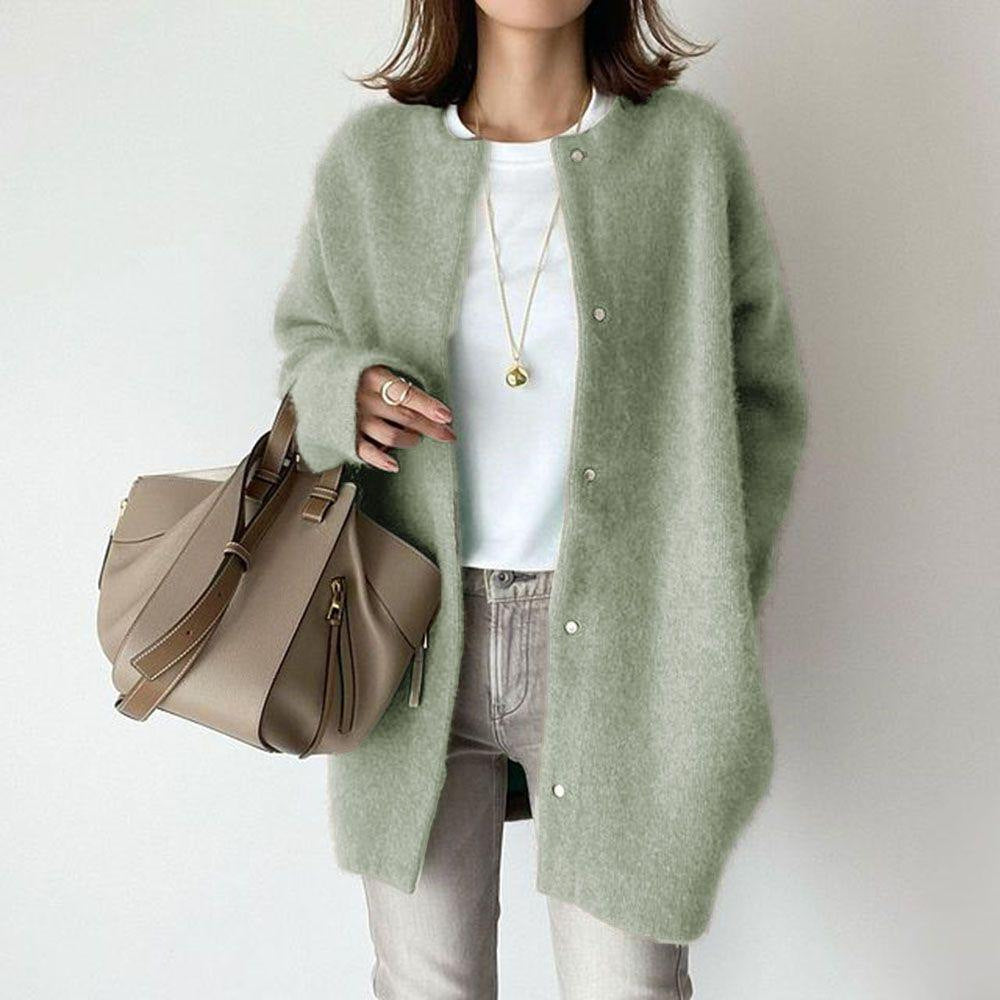 Round-neck button cardigan in light green worn over a white T-shirt