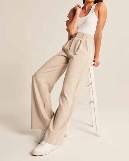 Pleated tailored trousers in cream, styled