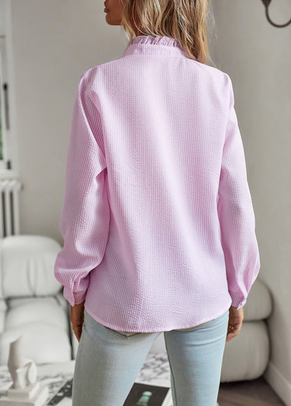 Back view of the ruffle-trim blouse in pink and white stripes