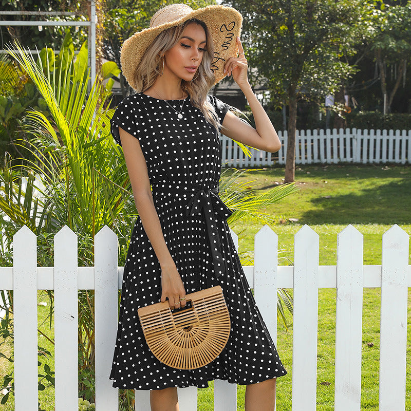 Polka-dot pleated midi dress in black