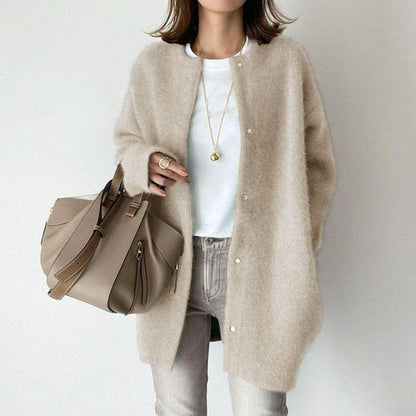 Longline button cardigan in beige apricot worn over a white T-shirt