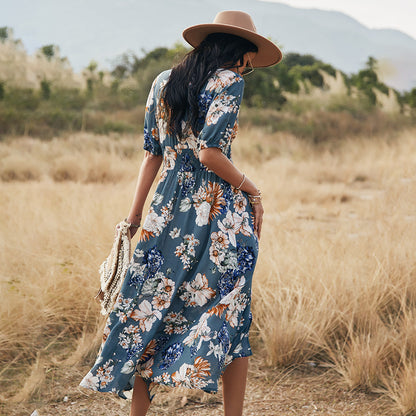 Floral day dress with a blue ground print, side view