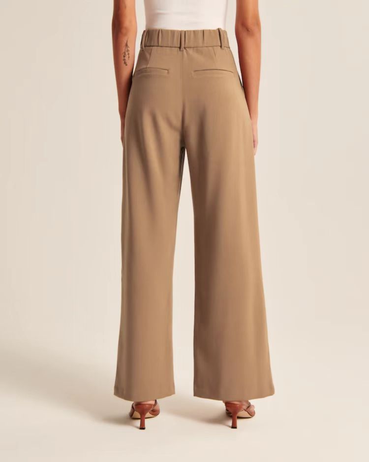 Pleated tailored trousers in camel, back view