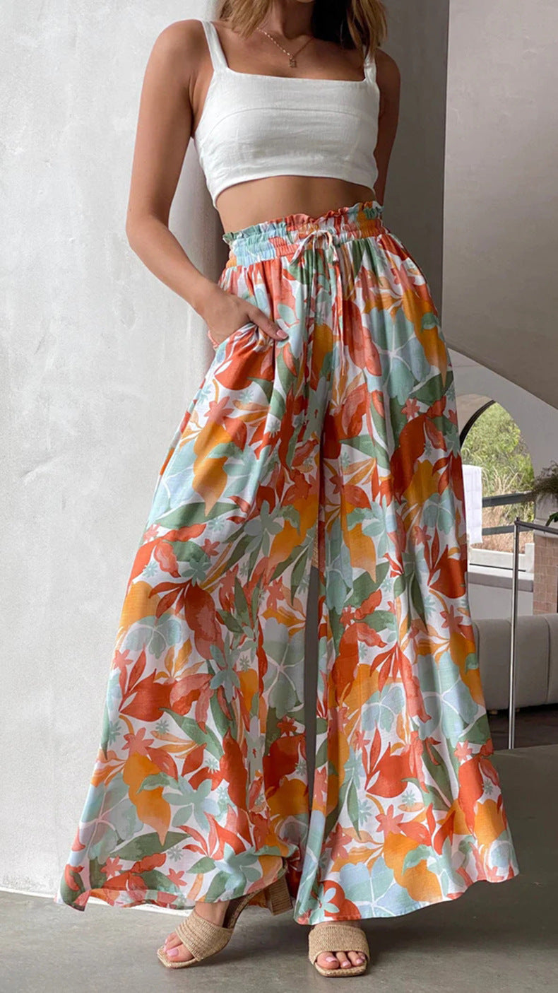 Flowing wide-leg drawstring trousers in a multicolour print
