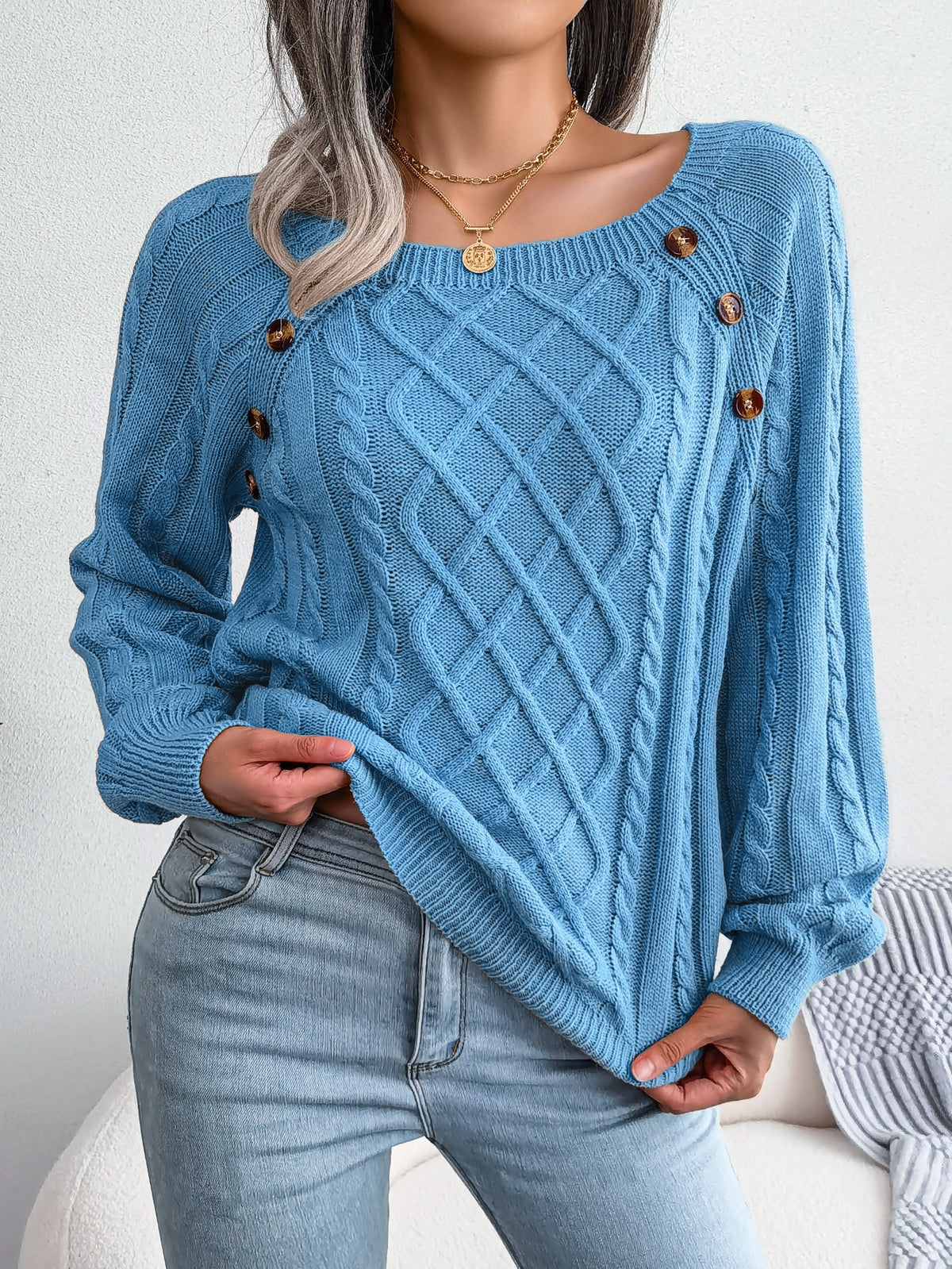 Button-detail cable-knit sweater in blue