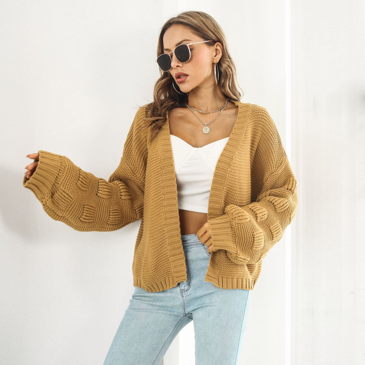 Balloon-sleeve cardigan in mustard yellow worn open