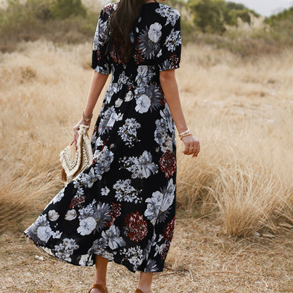 Floral day dress with a black ground print, walking