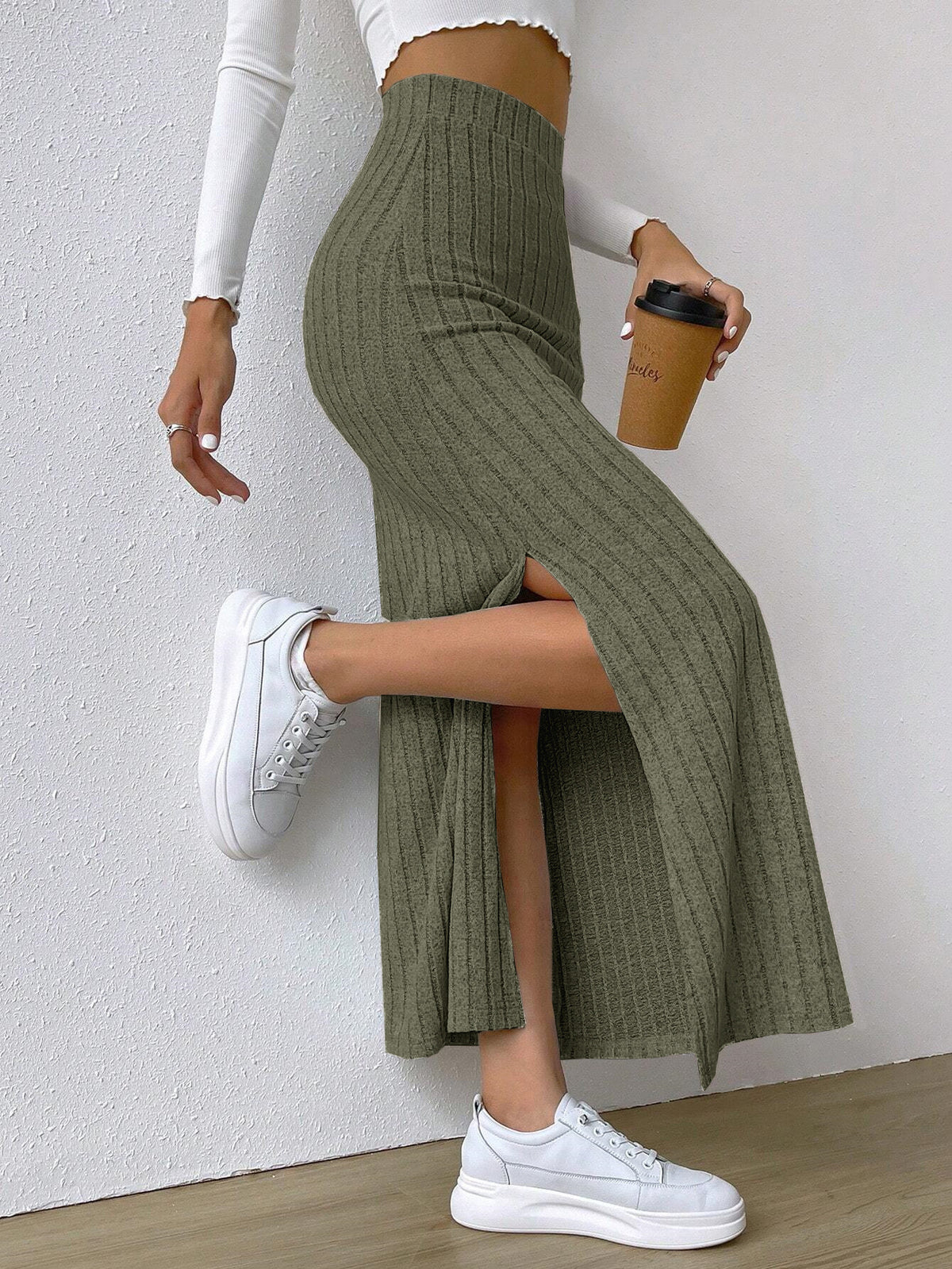 Ribbed maxi skirt showing the side slit in army green