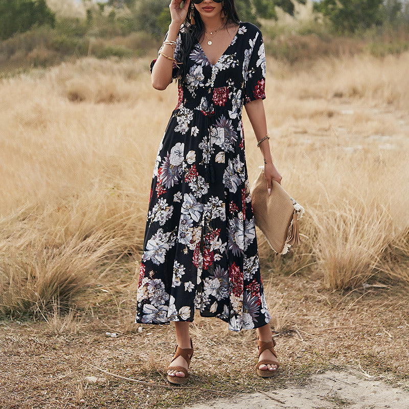 Floral day dress with a black ground print, full length