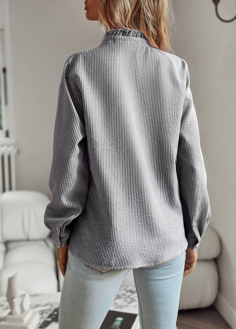 Back view of the black and white striped blouse