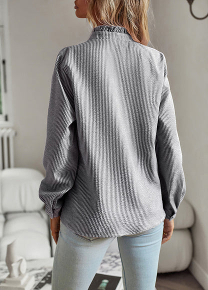 Back view of the black and white striped blouse